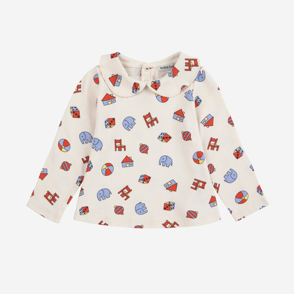 Children's shirt with colorful pattern on a white background
