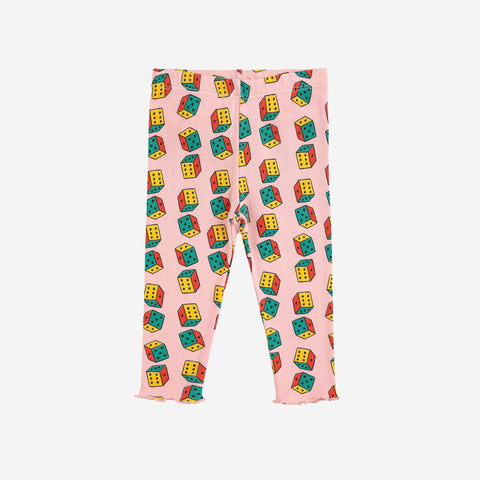 Pink baby leggings with colorful dice pattern on a white background