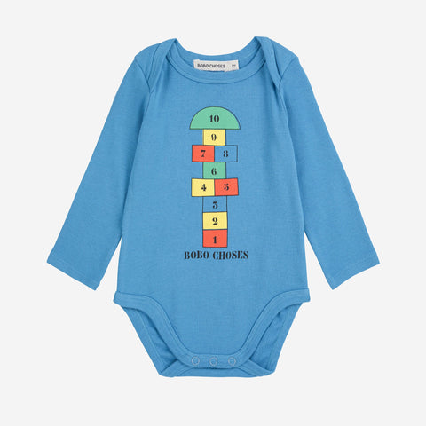 Blue baby bodysuit with colorful hopscotch number design on a white background